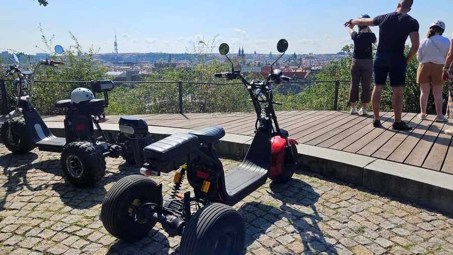 Prague: Heart of Prague Electric Tricycle Scooter Tour - Old Town icons near the Astronomical Clock and Clementinum
