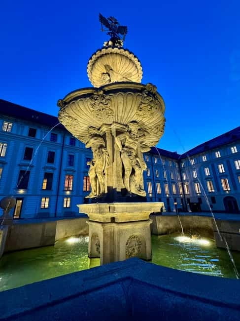 Prague: Night Walk through Prague Castle with City Views - The Ceremonial Gate, Giant Statues, and the Walk Toward the View