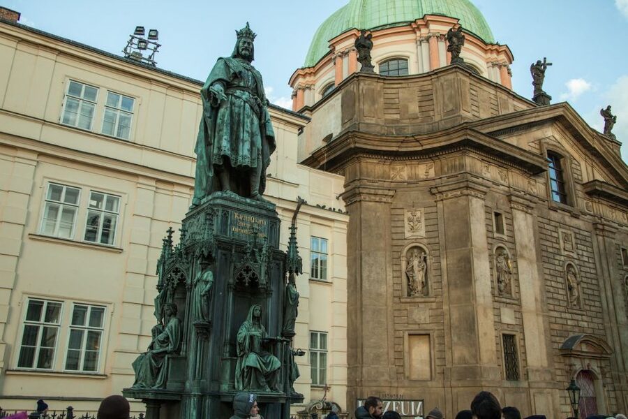 Prague: Old Town and Jewish Quarter Guided Tour in German - Clementinum and New Town Hall exteriors: a change of scenery