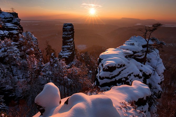 Pravcicka Gate & Bastei Bridge Winter National Park Tour from Prague - Stop 1: Pravcicka Gate, a snow-wrapped stone arch