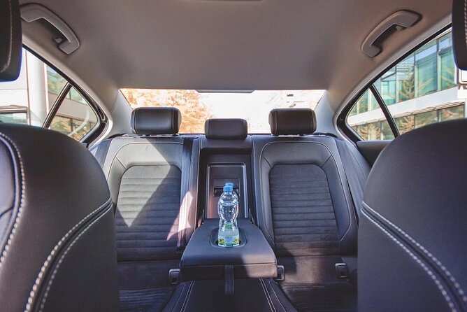 Private ARRIVAL Transfer by LIMOUSINE 3+1pax - The Meeting Point That Actually Works: Arrivals Hall with a Sign