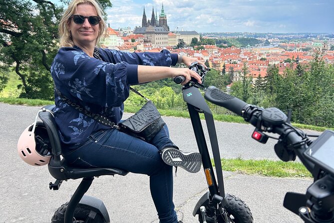Scooter tours to Prague Castle and views. - Charles Bridge area start and a quick Vltava bay moment